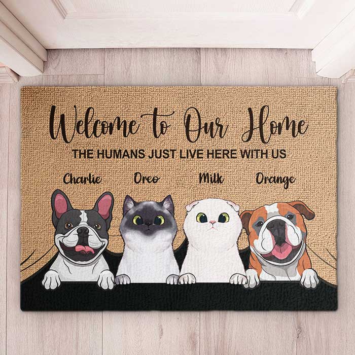 Personalized pet doormat with "Welcome to Our Home" message, featuring custom pet portraits.